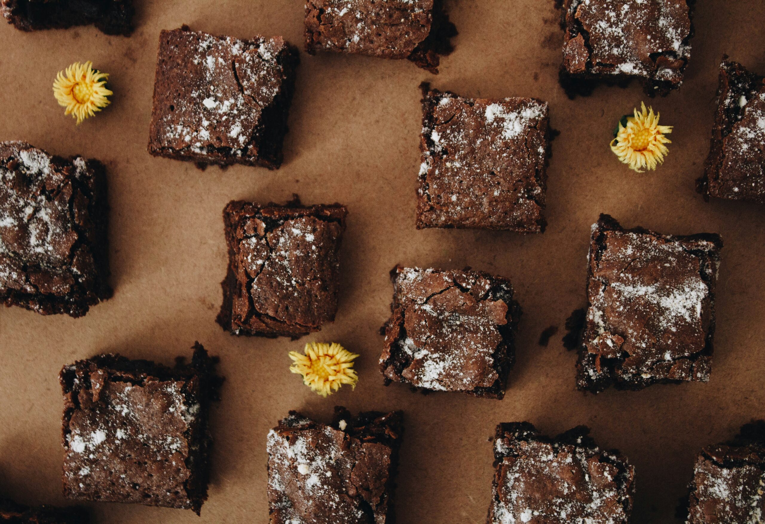 "Cute and artfully decorated brownie pieces captured close-up at one of the best pastry shops in Thrissur."